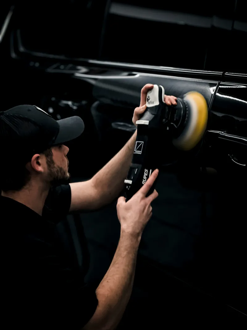 Certified technician performing paint correction